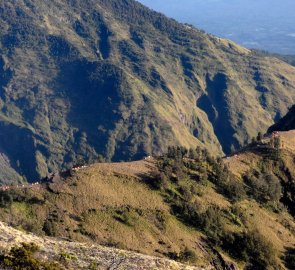 The edge of the cliff above Segara Anakpod Lake Gunung Rinjani with the tents of the first bivouac site