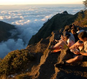 Dinner over the edge of the cliff in the second bivouac during the ascent to Rinjani